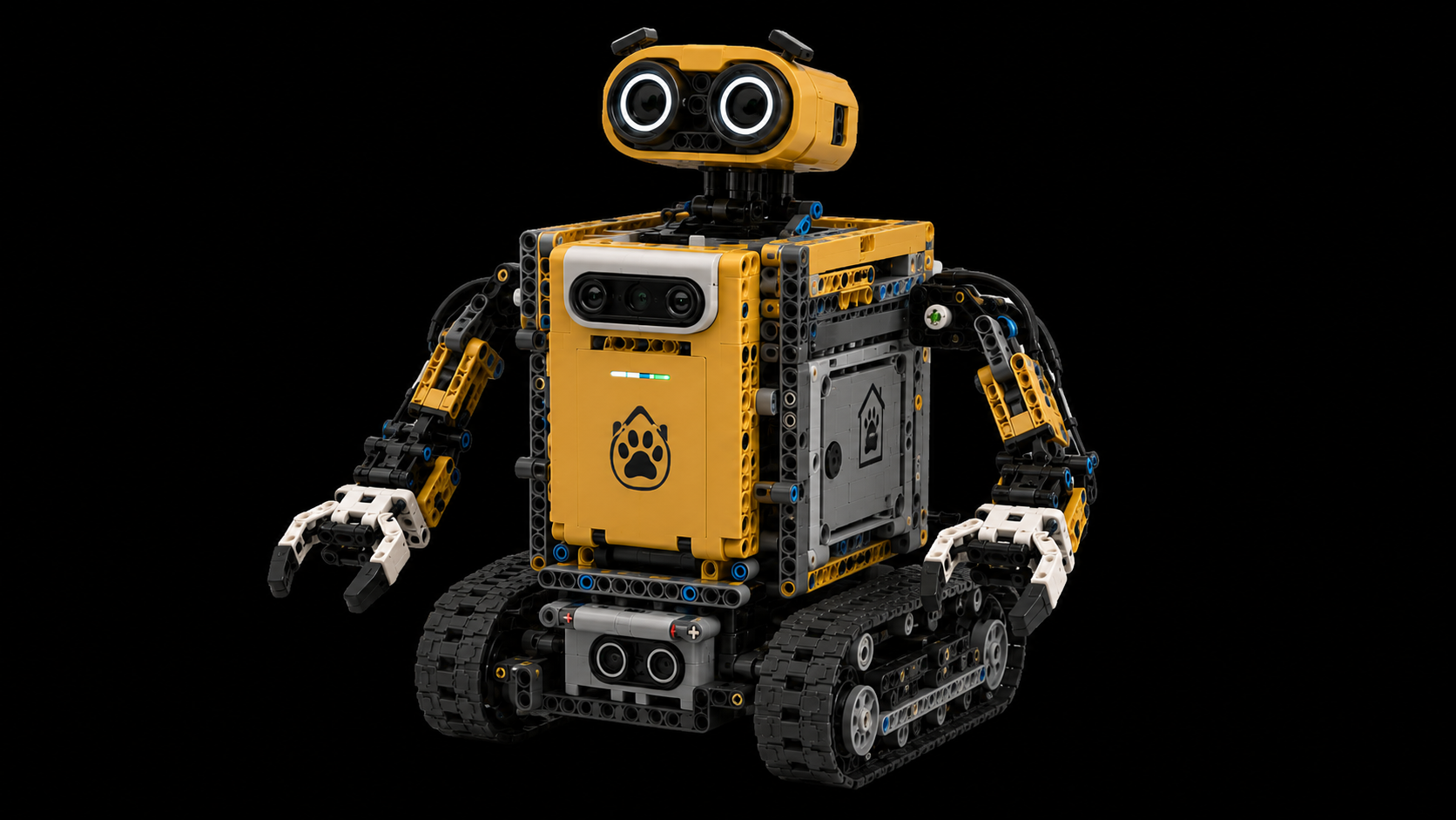 Assembled yellow Lego robot on tracks.